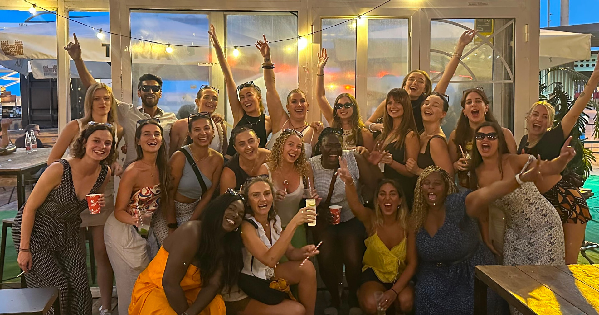 Barcelona Netball Club members and friends celebrating together at a summer social