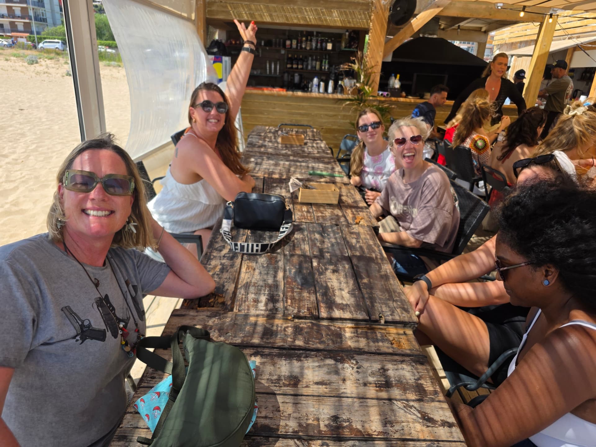 Barcelona Netball Club members enjoying a social gathering by the beach